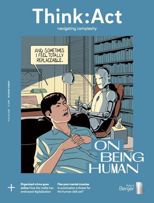 Think:Act Magazine cover with a teal blue background and a large, centered cartoon of a human in the foreground and a robot sitting at a desk on an office chair in the background, turned towards the human. Speech bubble top-left shows “and sometimes I feel totally replaceable.”