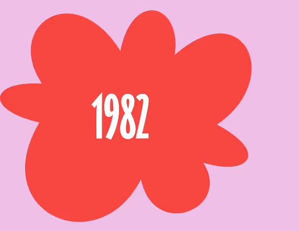 Red flower-shaped design with white text reading '1982' centered inside.