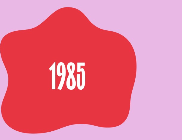 Red blob or organic-shaped design with white text reading '1985' centered inside.