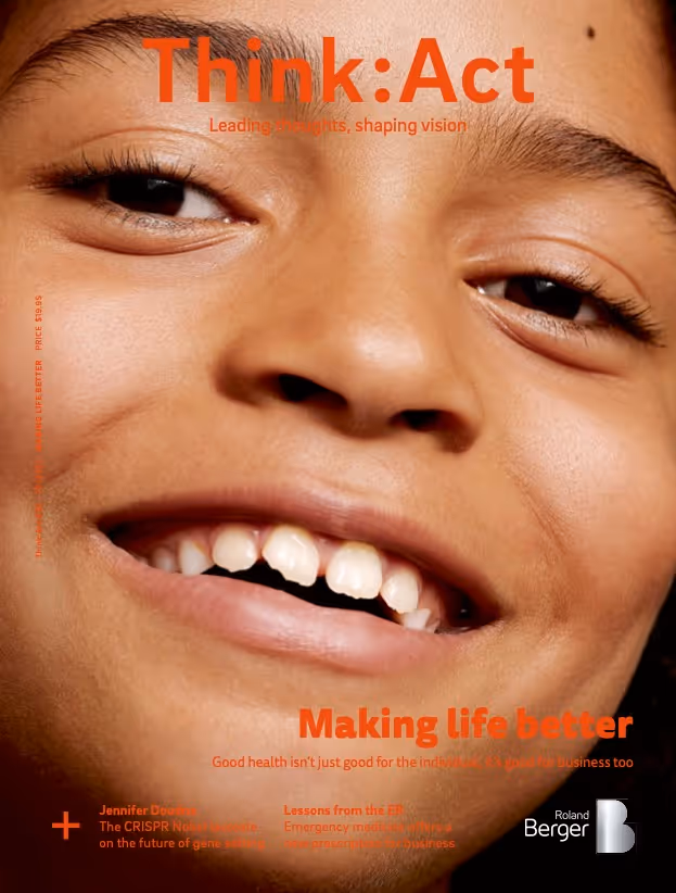 Think:Act Magazine cover with a close-up image of a smiling child’s face filling the background. The title “Think:Act” is displayed in bold orange letters at the top of the cover. 