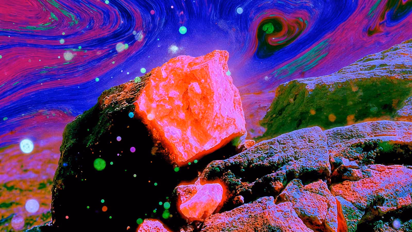 A jagged, highly textured rock formation features a glowing neon pink surface, set against a swirling, fluid-like background of vibrant blue and magenta. Glowing, colorful orbs float around the dark, shadowed stones.