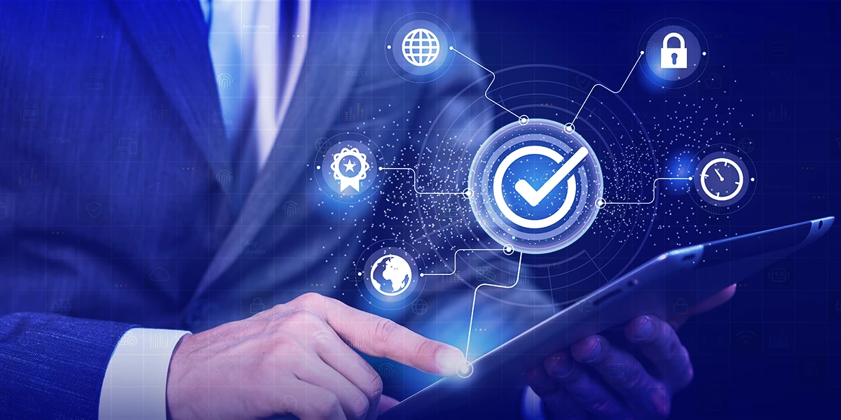 Business professional using tablet with cybersecurity and compliance icons overlay.