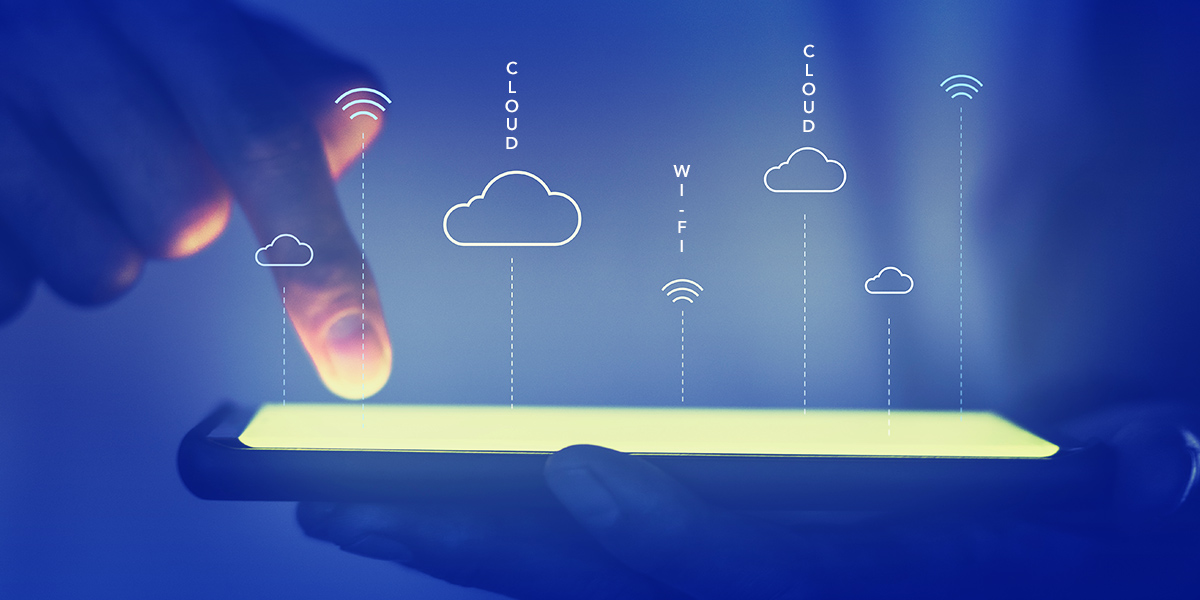 hand pointing at tablet with blue background