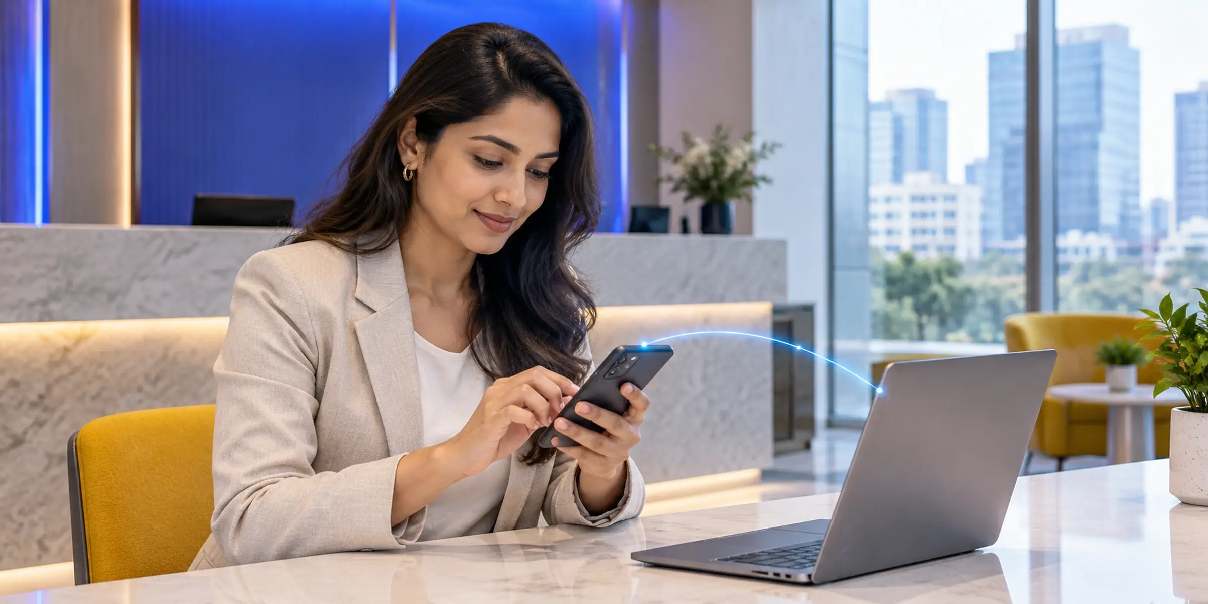 Business guest using a smartphone beside a laptop, with a blue connection illustrating guest Wi-Fi authentication.