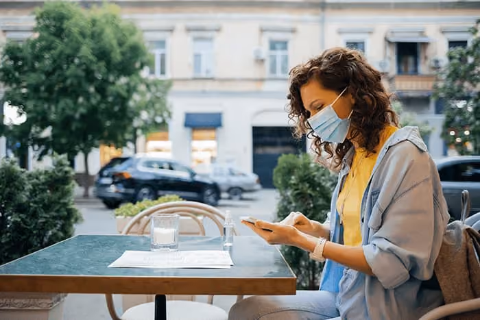 mask lady operate mobile
