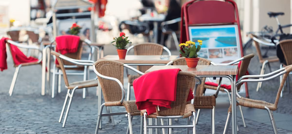 open area of restaurant with chairs and table