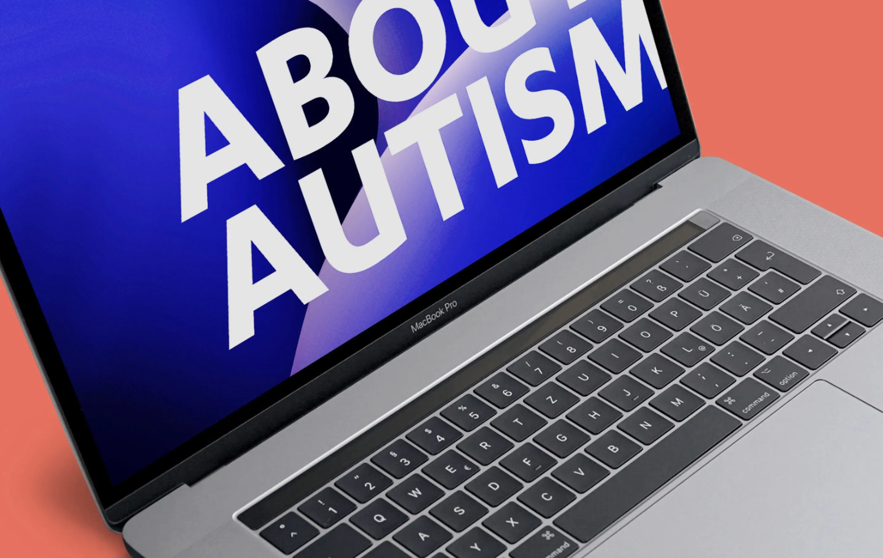 close up of laptop showing website on angle on a red backdrop