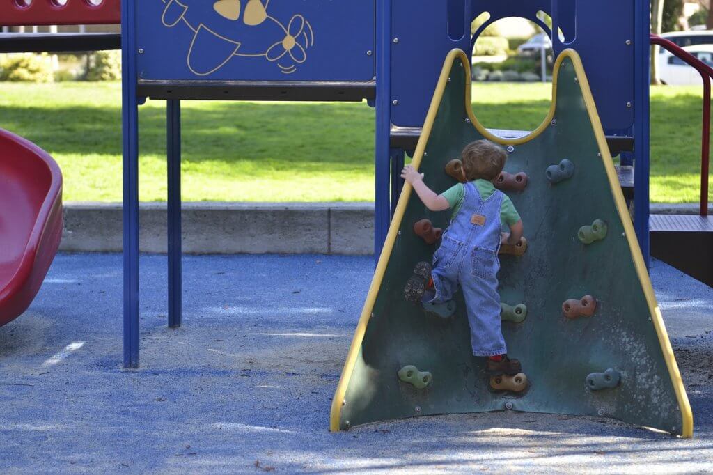 Good sports parents encourage all types of activities like climbing or playing at a playground