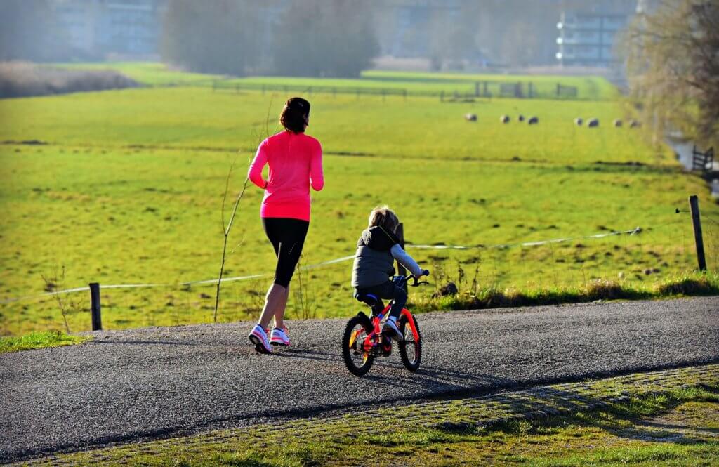 Sports parent getting active with her child