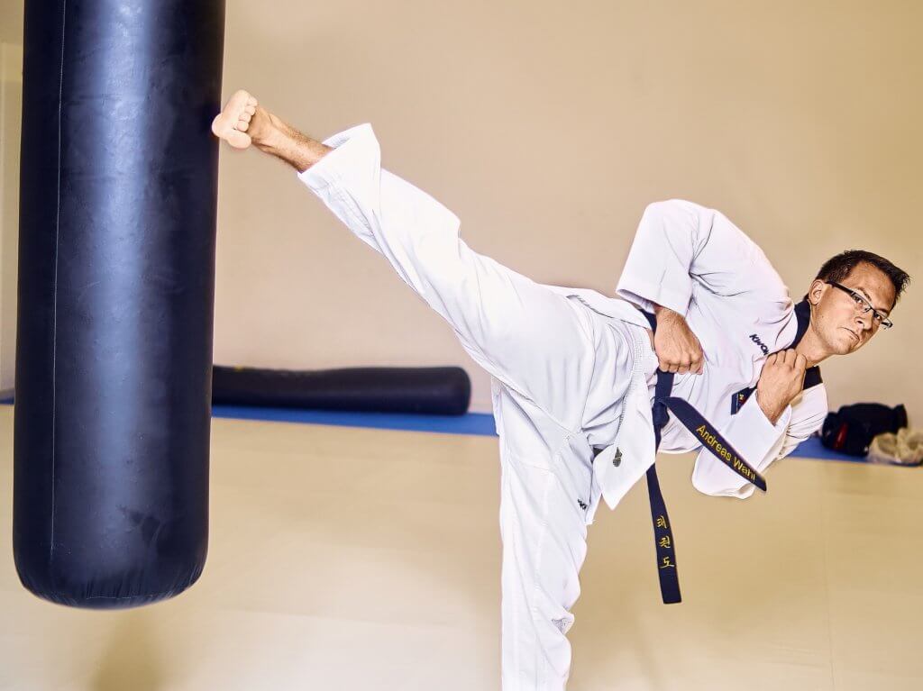 Taekwondo kick on a heavy bag.