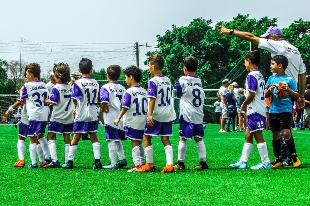 Soccer coach embodying the sports club brand. 