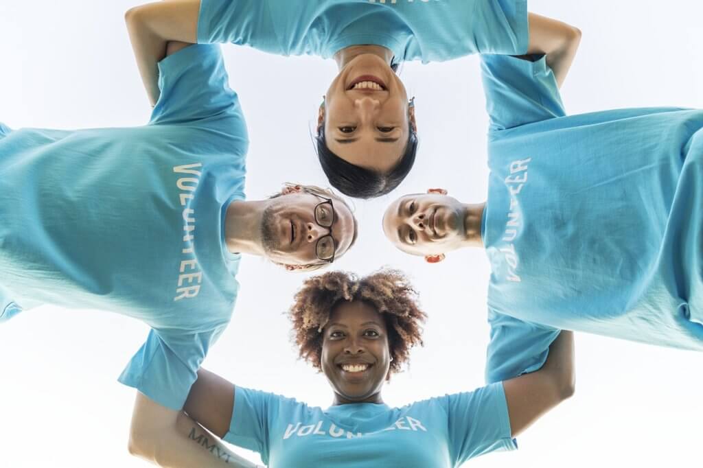 Empowered volunteers in a huddle