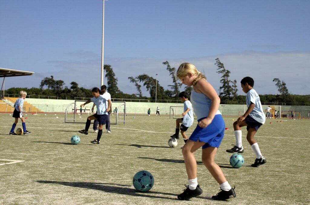 Kids playing soccer and getting the benefits of exercise