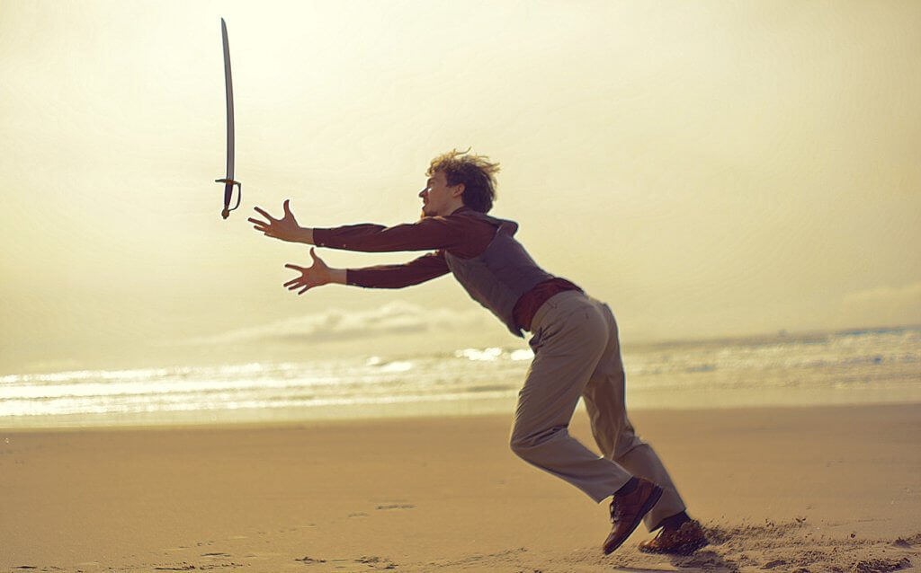 Man dropping a sword