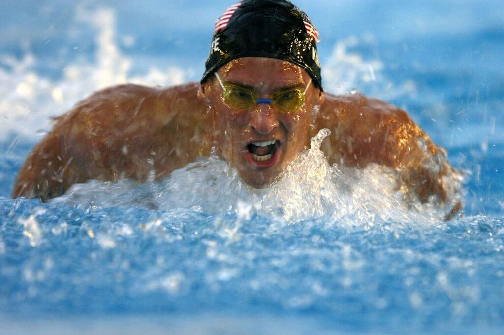 Olympic quotes from swimmers like this athlete performing the breast stroke.