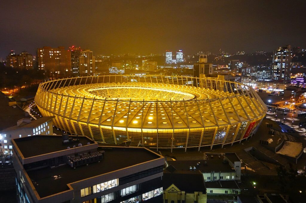 Olympic stadium glowing at night