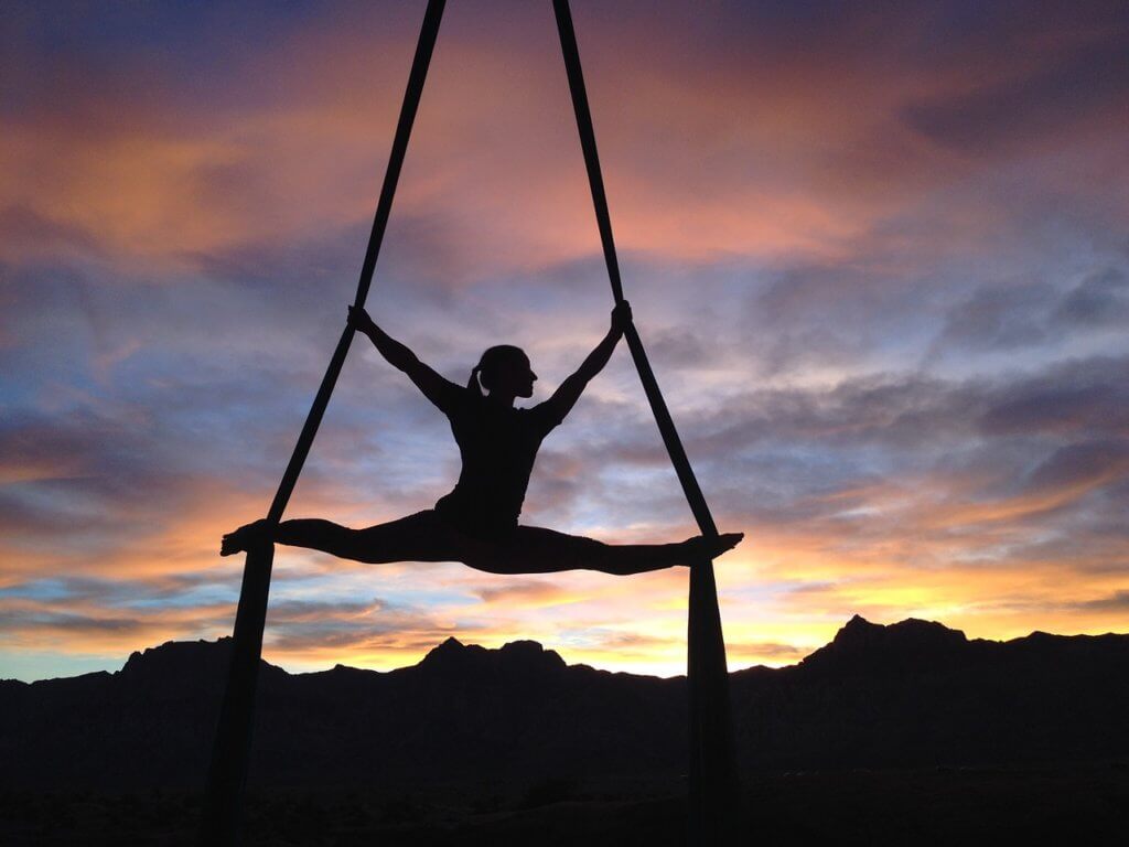 Artistic gymnast at sunset