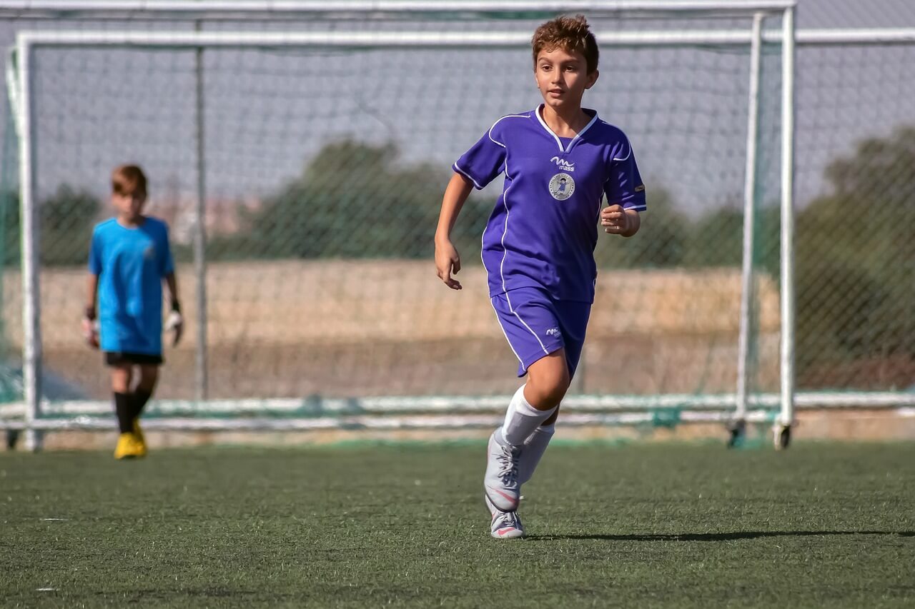 Kids playing soccer at a soccer club