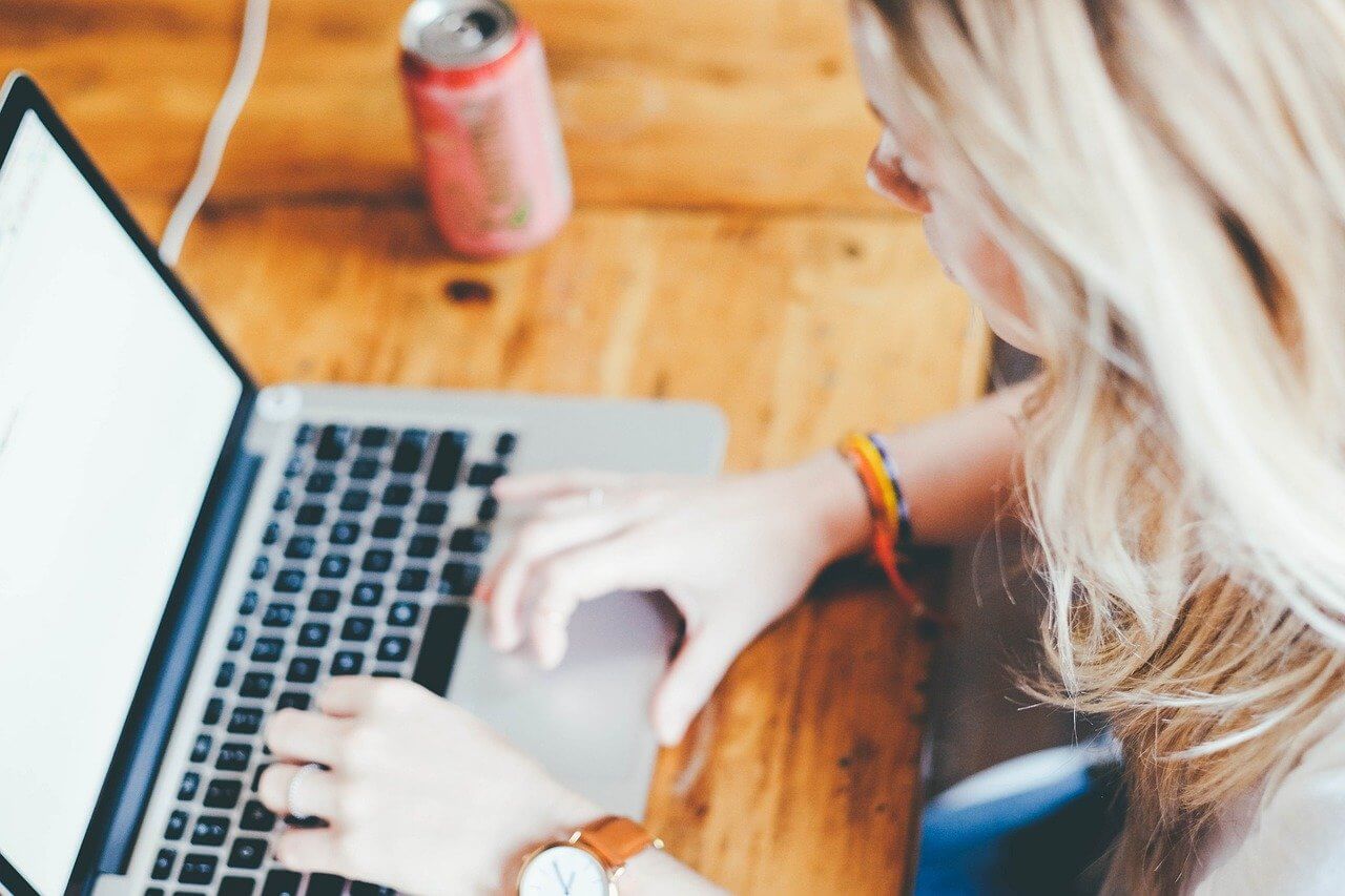 Tracking figure skating financial reports on a laptop