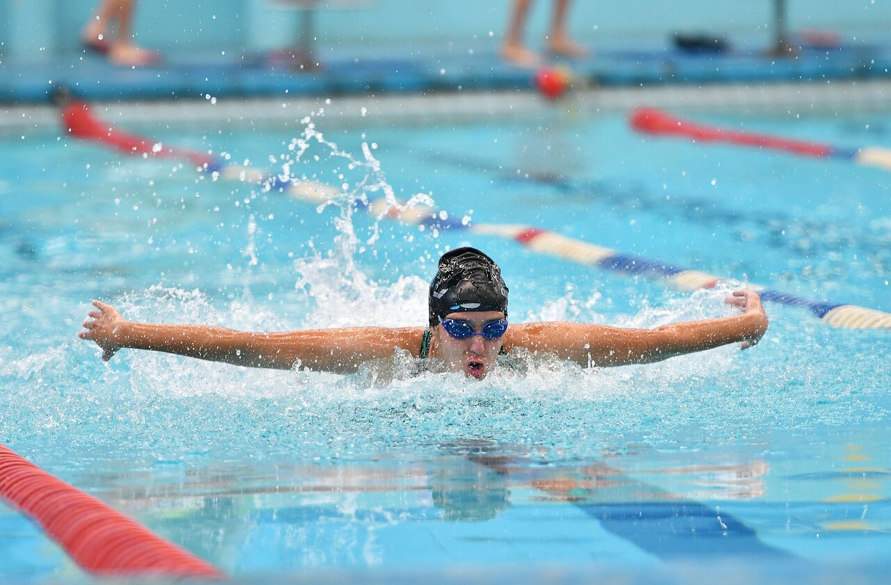 Kids training in a swimming pool at swim club