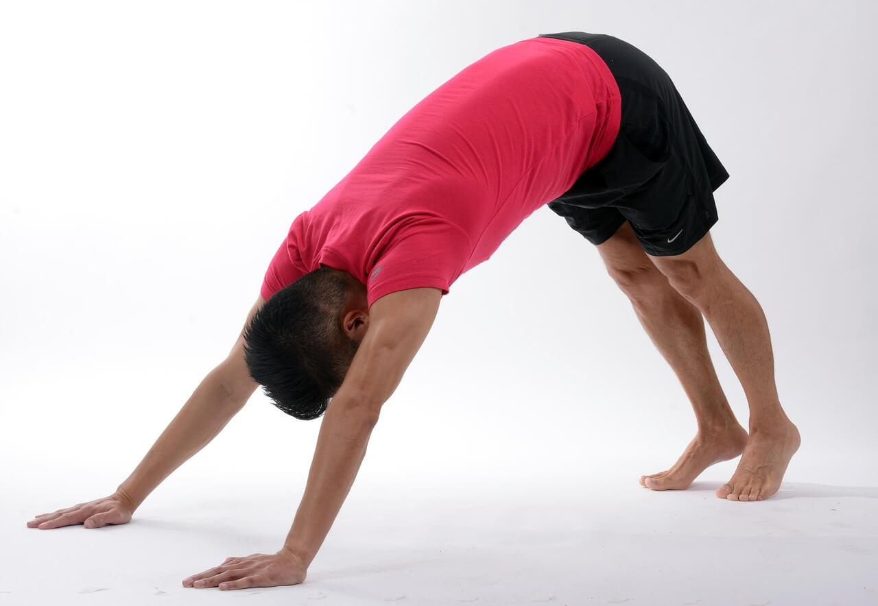 Coach stretching during a virtual training session.