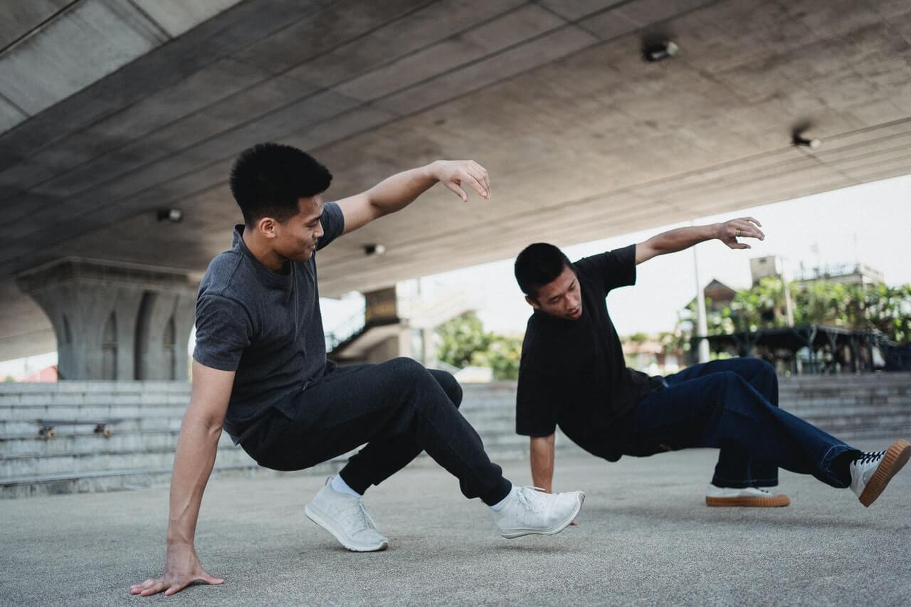 Two men breakdancing outside