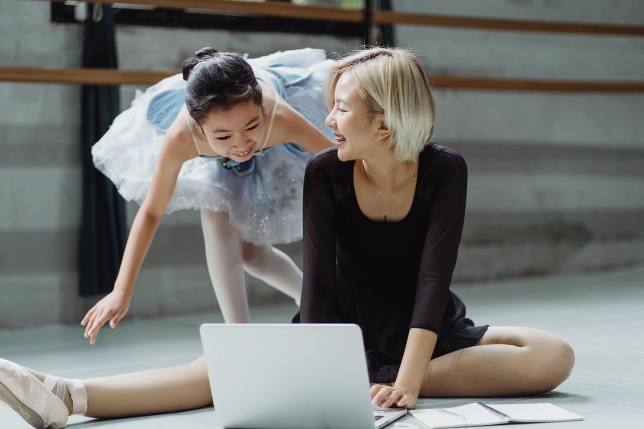 Dancer happy to see dance instructor