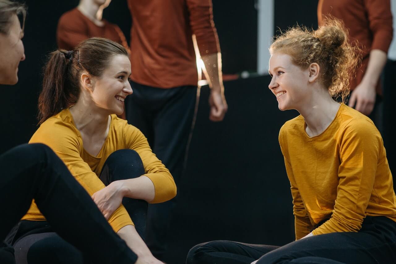 Two dancers laughing at funny dance quotes