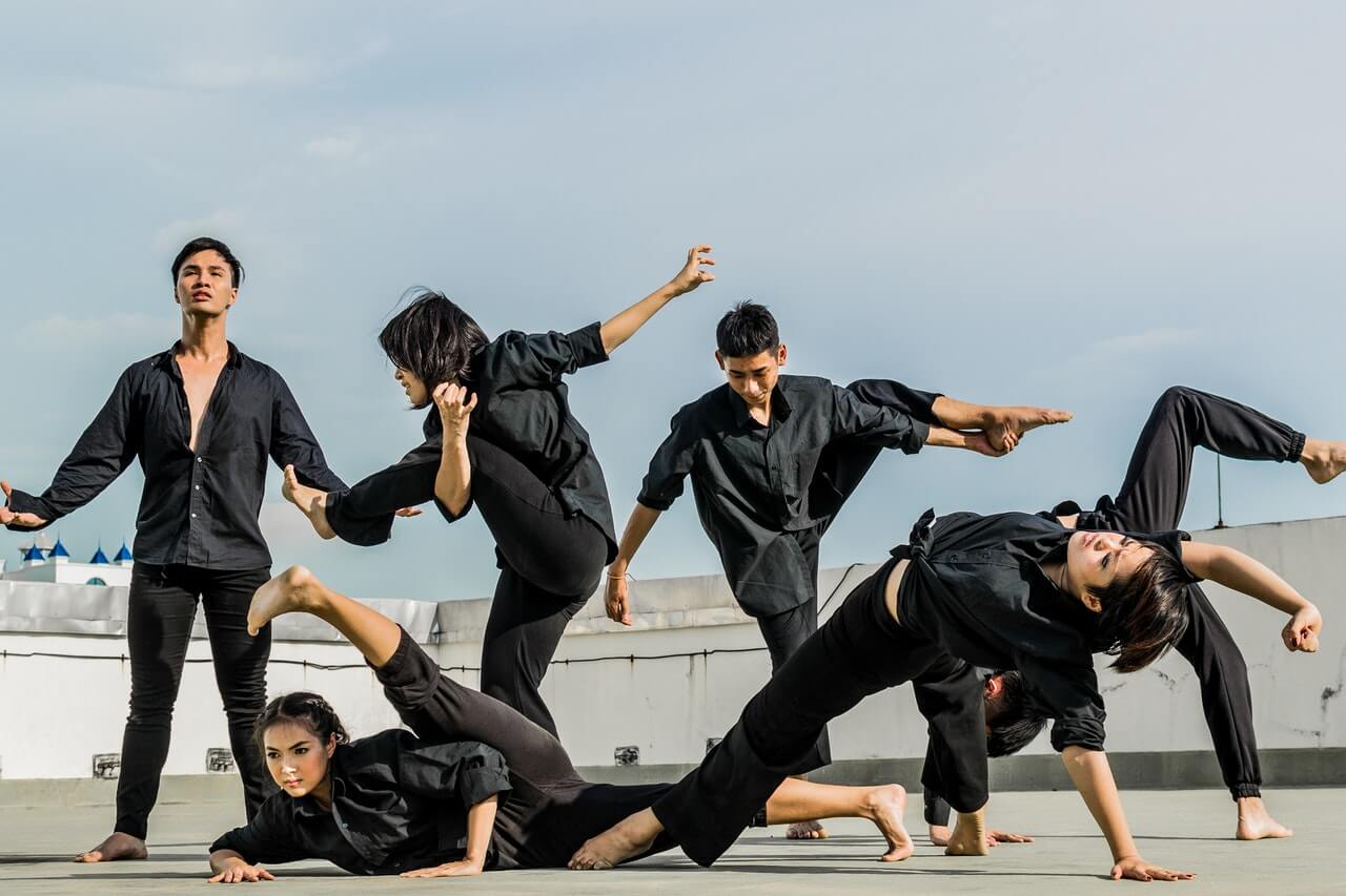 Group of dancers collaborating as part of thesocial benefits of dance