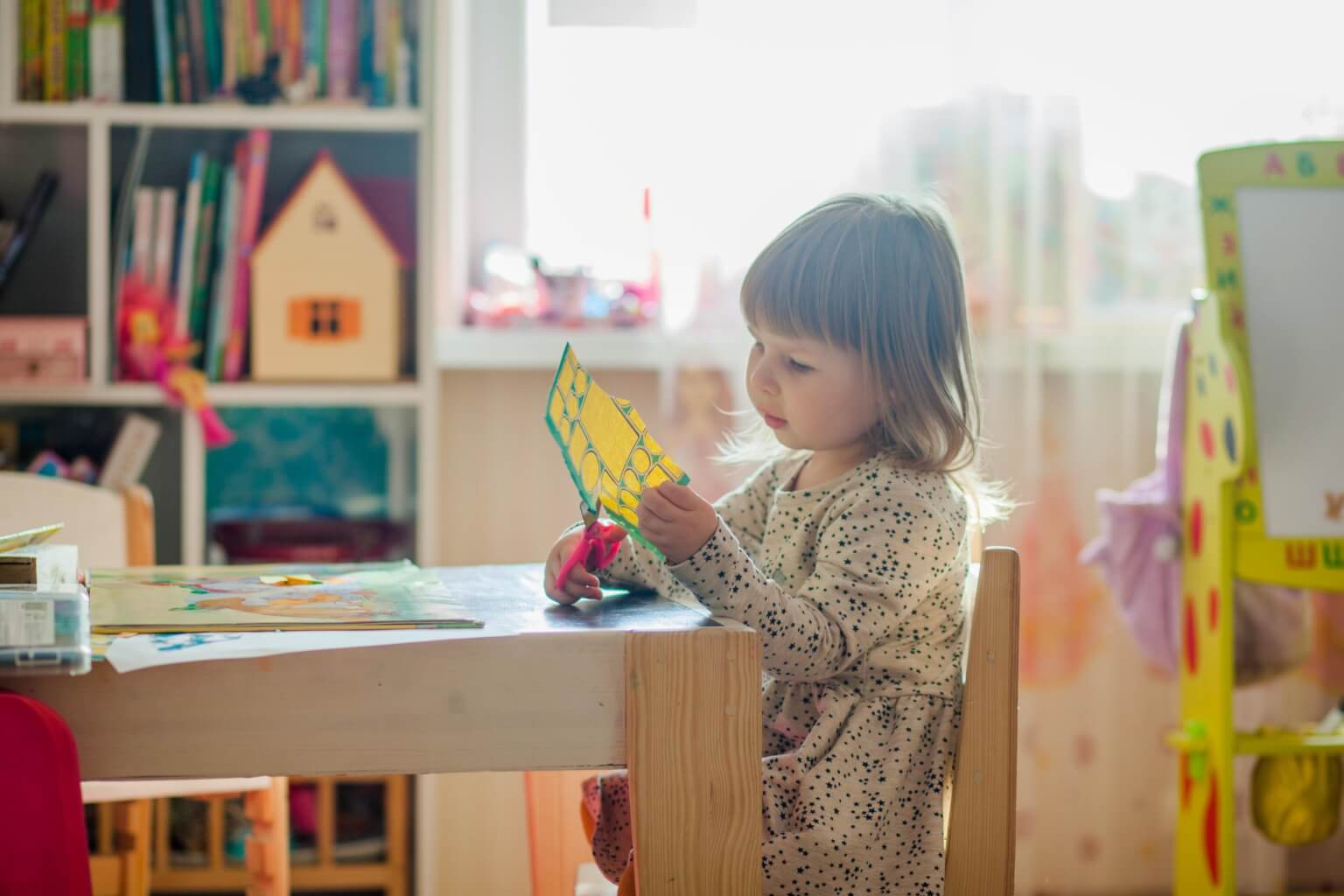 A child explores creating something new as one of the benefits of makerspace