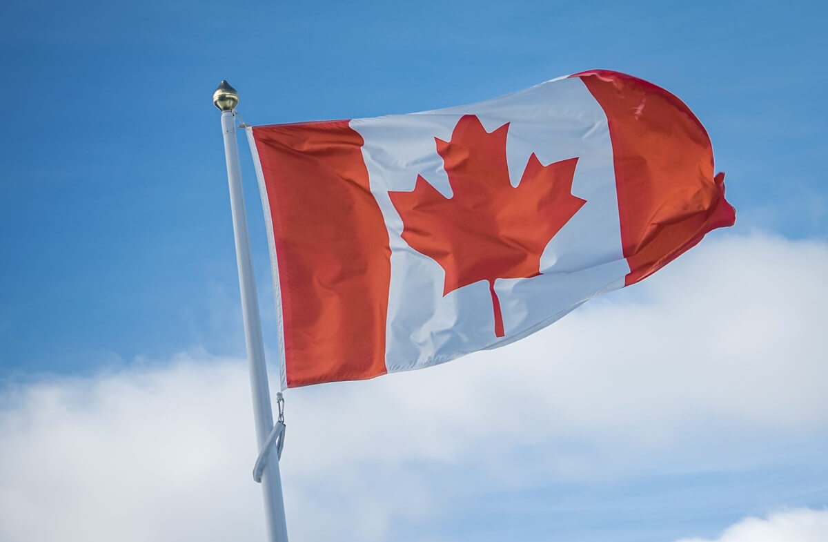 Canadian flag representing the question: how many figure skaters are in Canada?