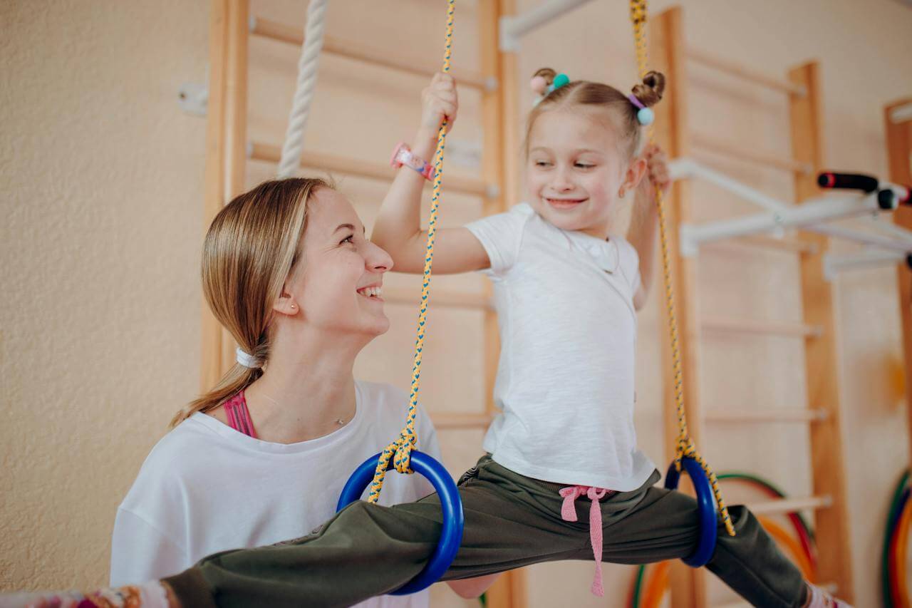 An instructor enjoying coaching now that gymnastics attendance tracking is taken care of. 