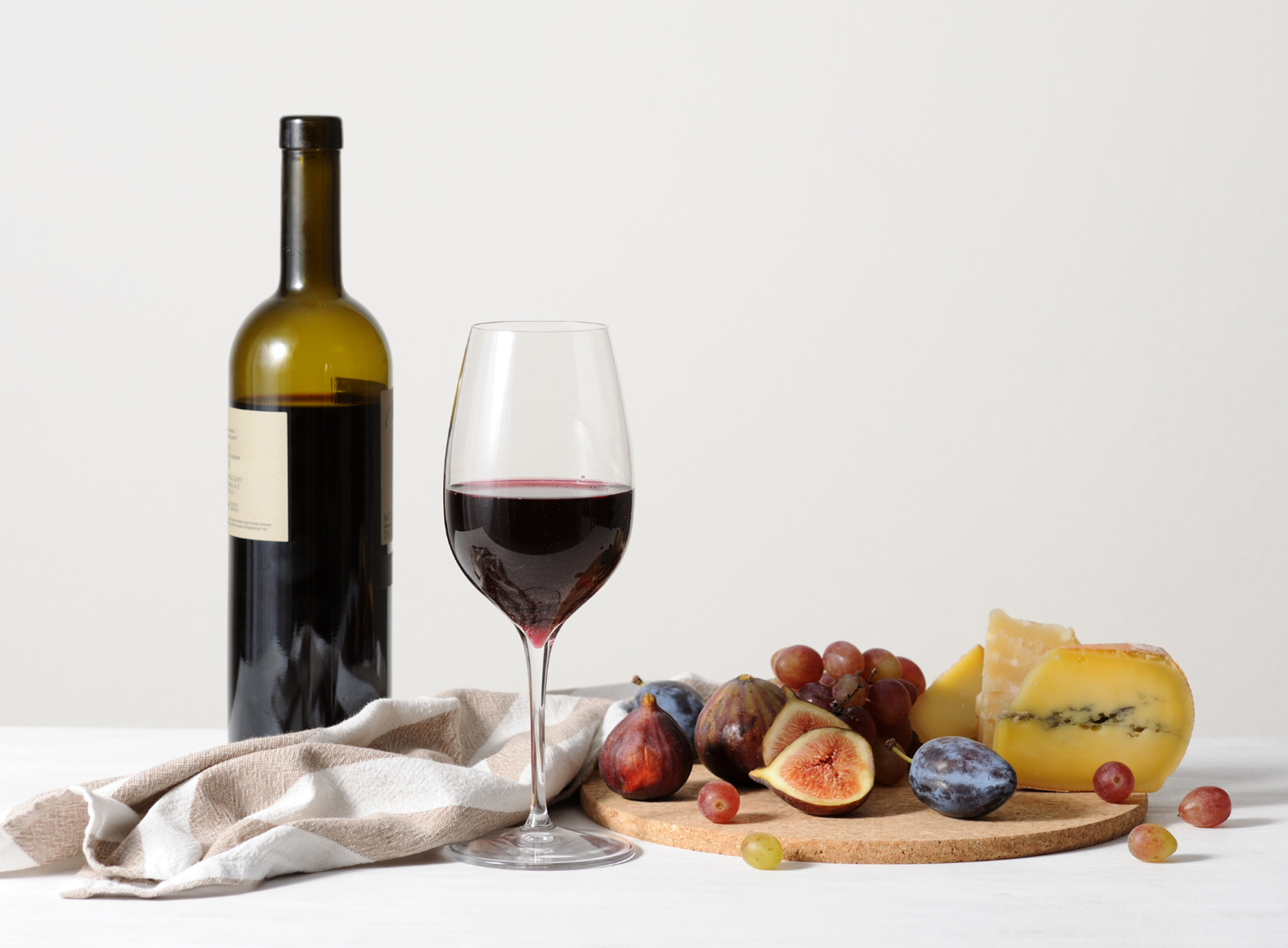 still life with red wine, cheese and fruits