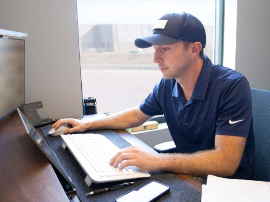 Person working at computer. 