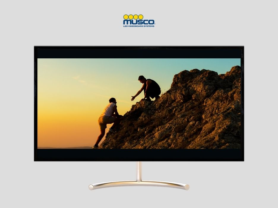 TV depicting two people climbing a mountain.