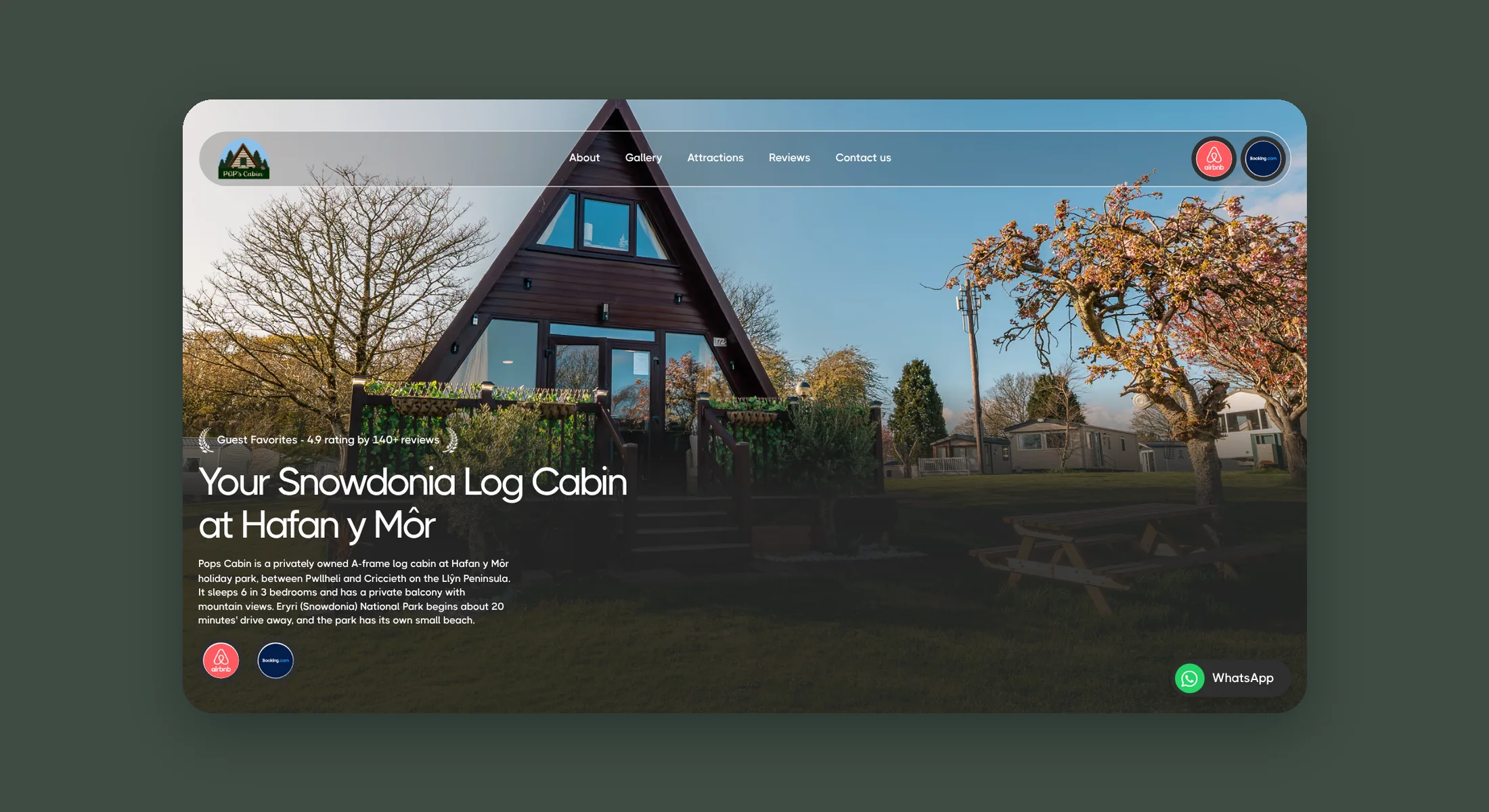 Snowdonia Log Cabin homepage hero with the A frame cabin under a blue sky