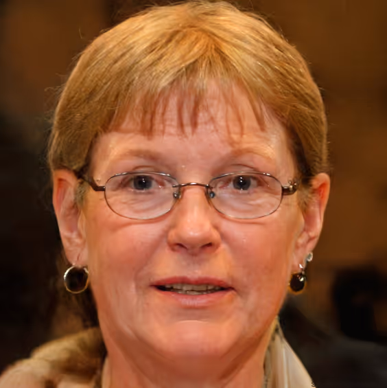 A portrait of Annette, who is a middle-aged woman with glasses and earrings returning to piano with new confidence.