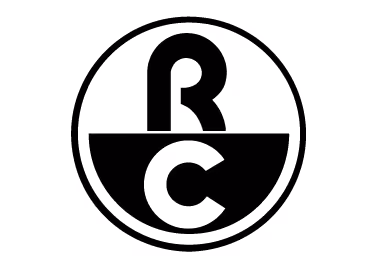 Ein schwarzes Logo mit einem runden Design. Im oberen Bereich befindet sich ein stilisiertes 'R', im unteren Teil ein 'C', beide sind in einem halbkreisförmigen Format angeordnet.