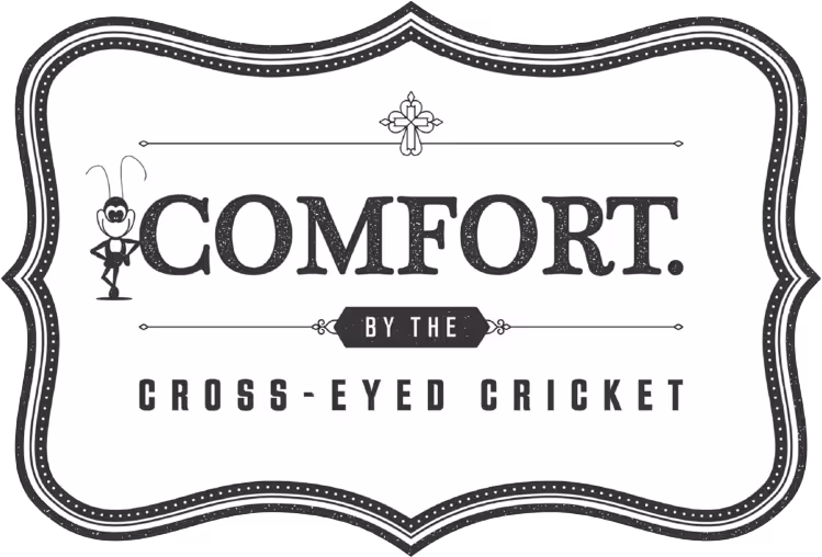 A stylish logo featuring the word "COMFORT" with a playful cricket illustration, labeled "by the Cross-Eyed Cricket."