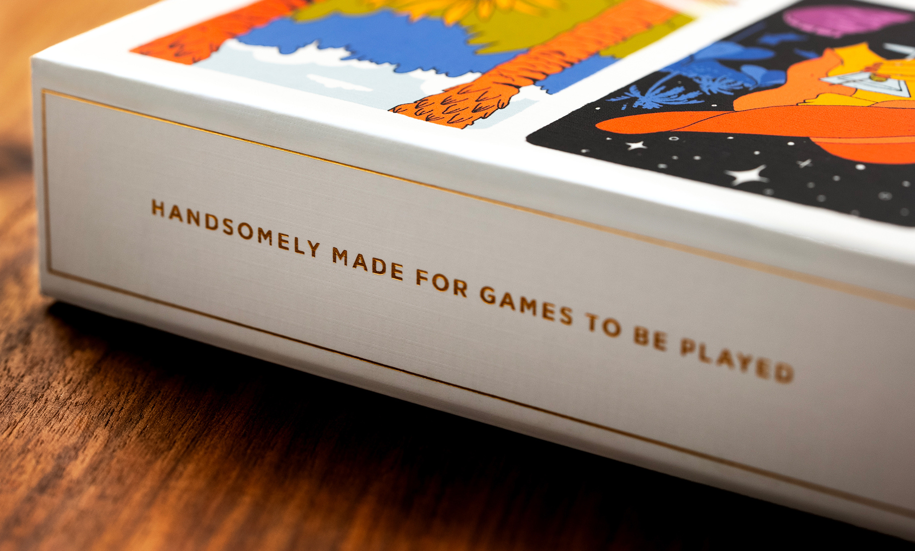 The side of the gift box for the playing cards saying, “Handsomely made for Games to be played.”