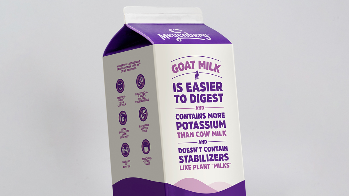 Meyenberg goat milk carton showing logo and nutritional attributes.