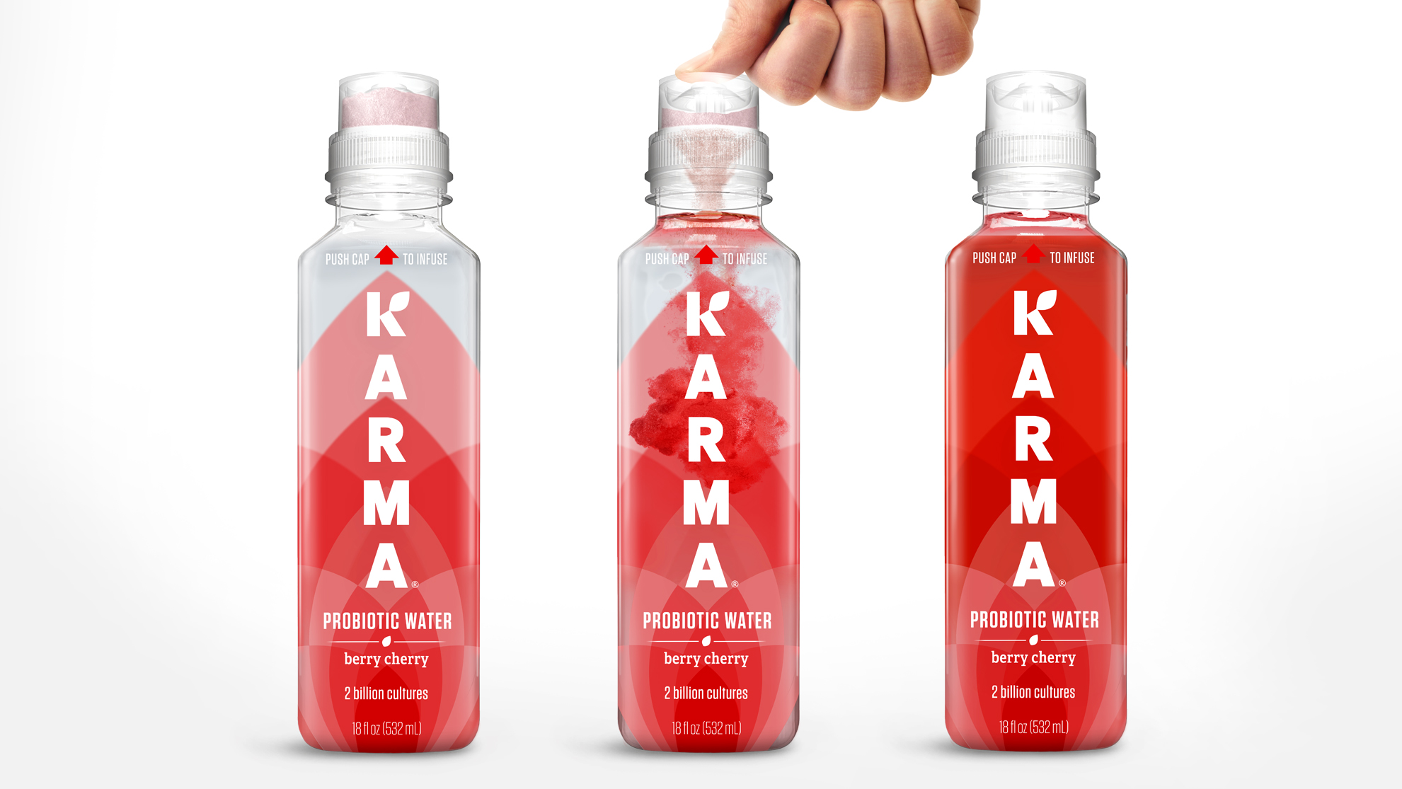Three bottles of Karma Berry Cherry probiotic water with new packaging. A thumb pushes down on the cap of the middle bottle.