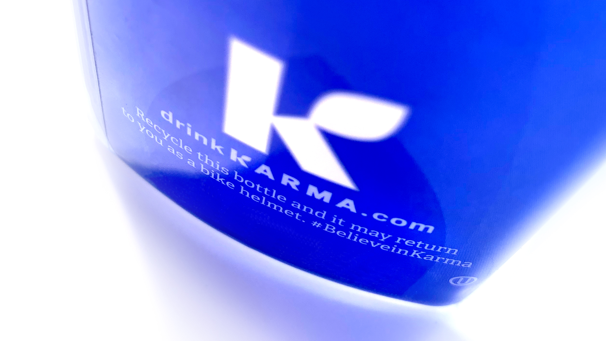 Bottom of a Karma Water bottle showing recycling instructions.