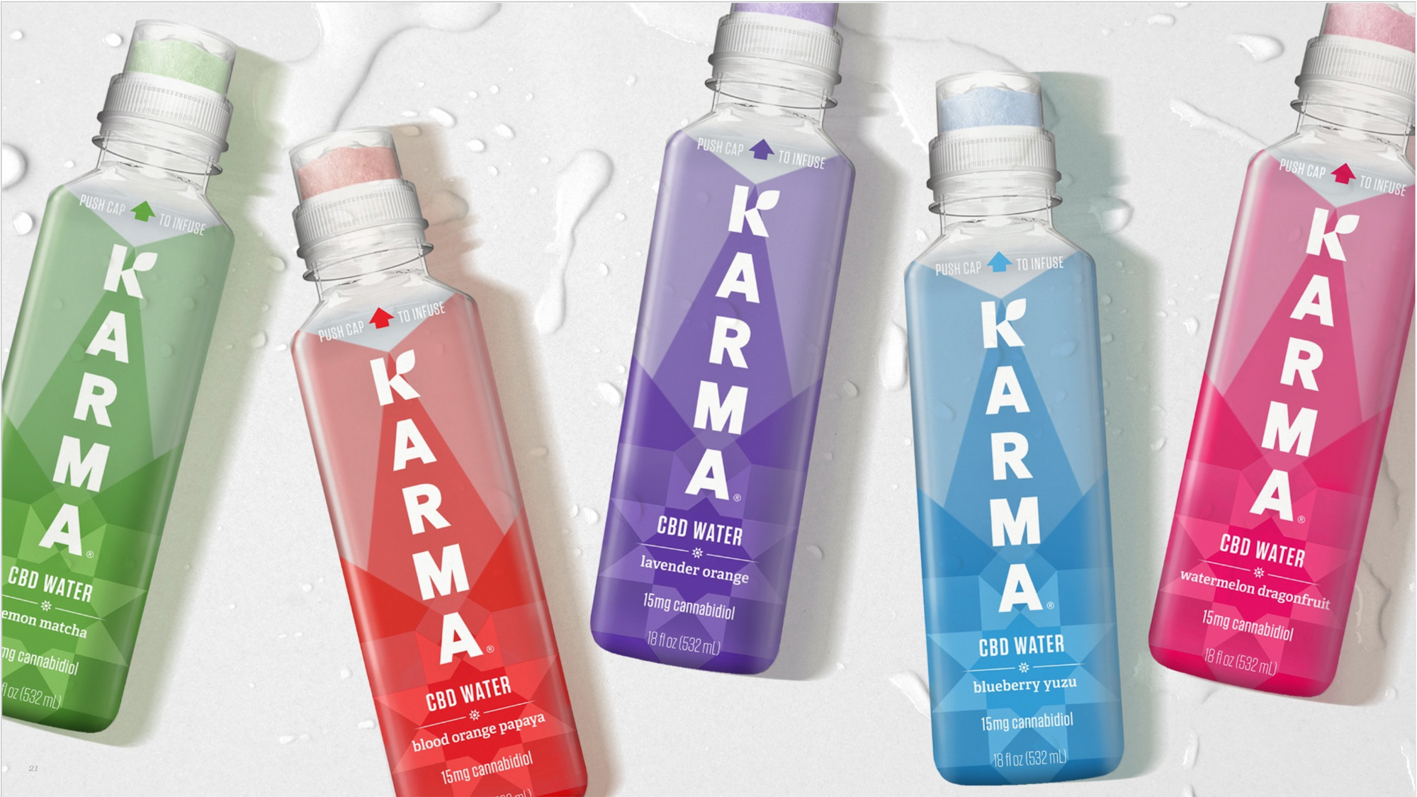 Lineup of five Karma CBD water bottles in different flavors.