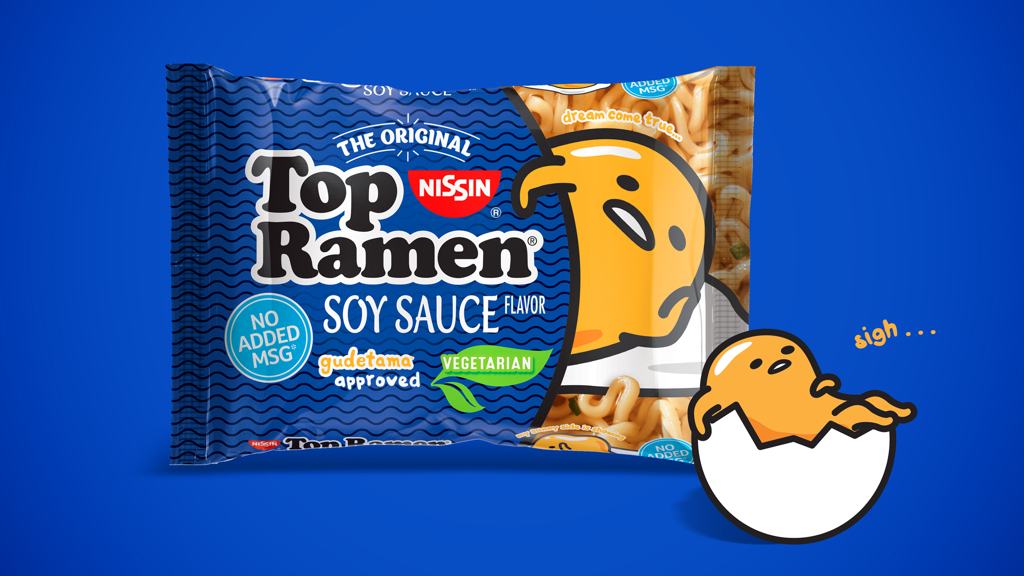 A Top Ramen Soy Sauce Gudetama package. Next to it is Gudetama sitting in a cracked eggshell saying “sigh.”