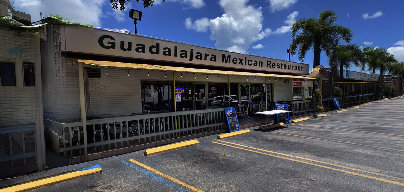 Outdoor seating area of Guadalajara Mexican Restaurant, showcasing its inviting facade.