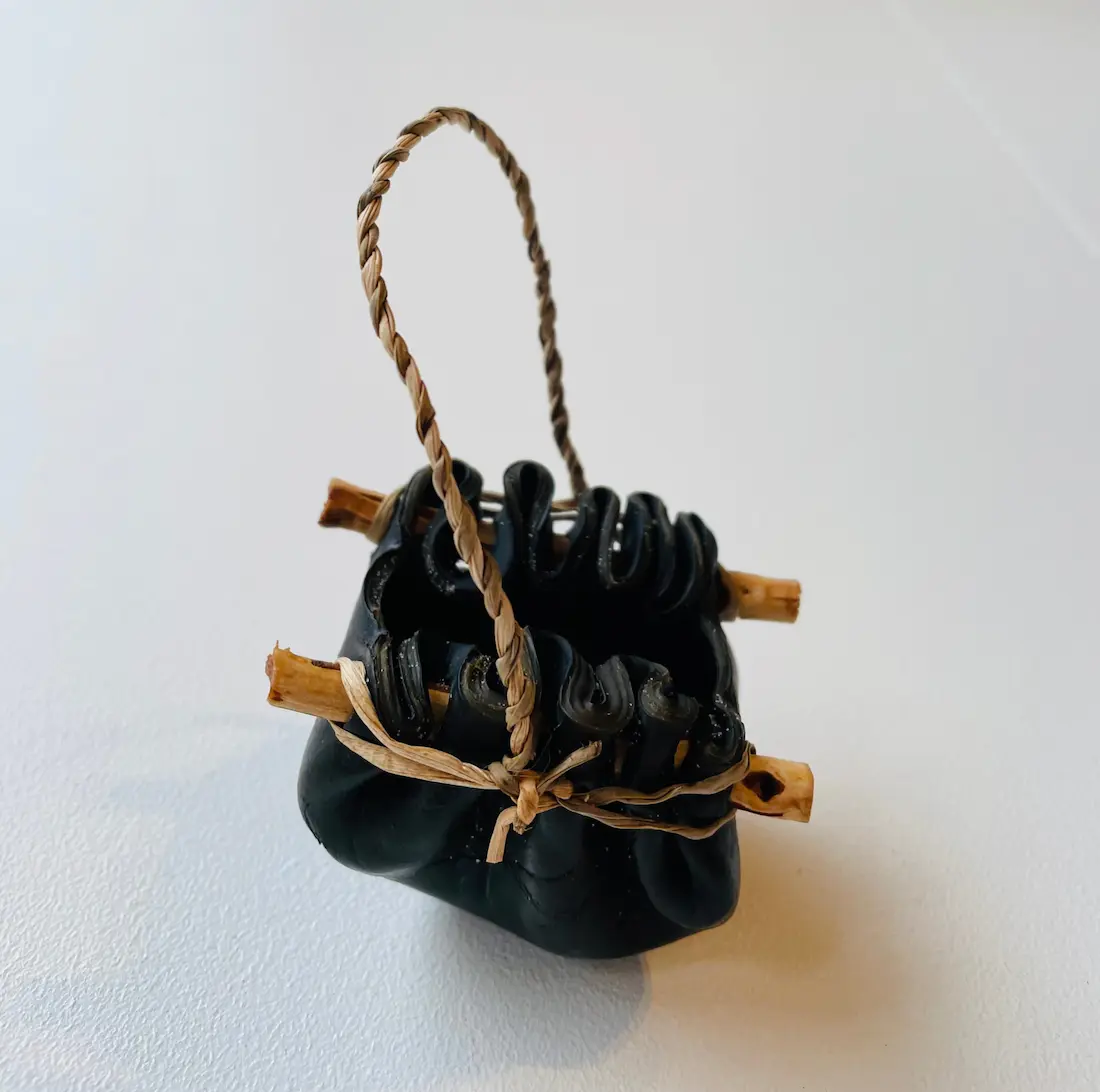 Nannette Shaw, Kelp vessel, 2021, bull kelp, native Tasmanian timber & river reed, extra small, approximately 4 x 7 x 5 cm (dimensions exclude handle)