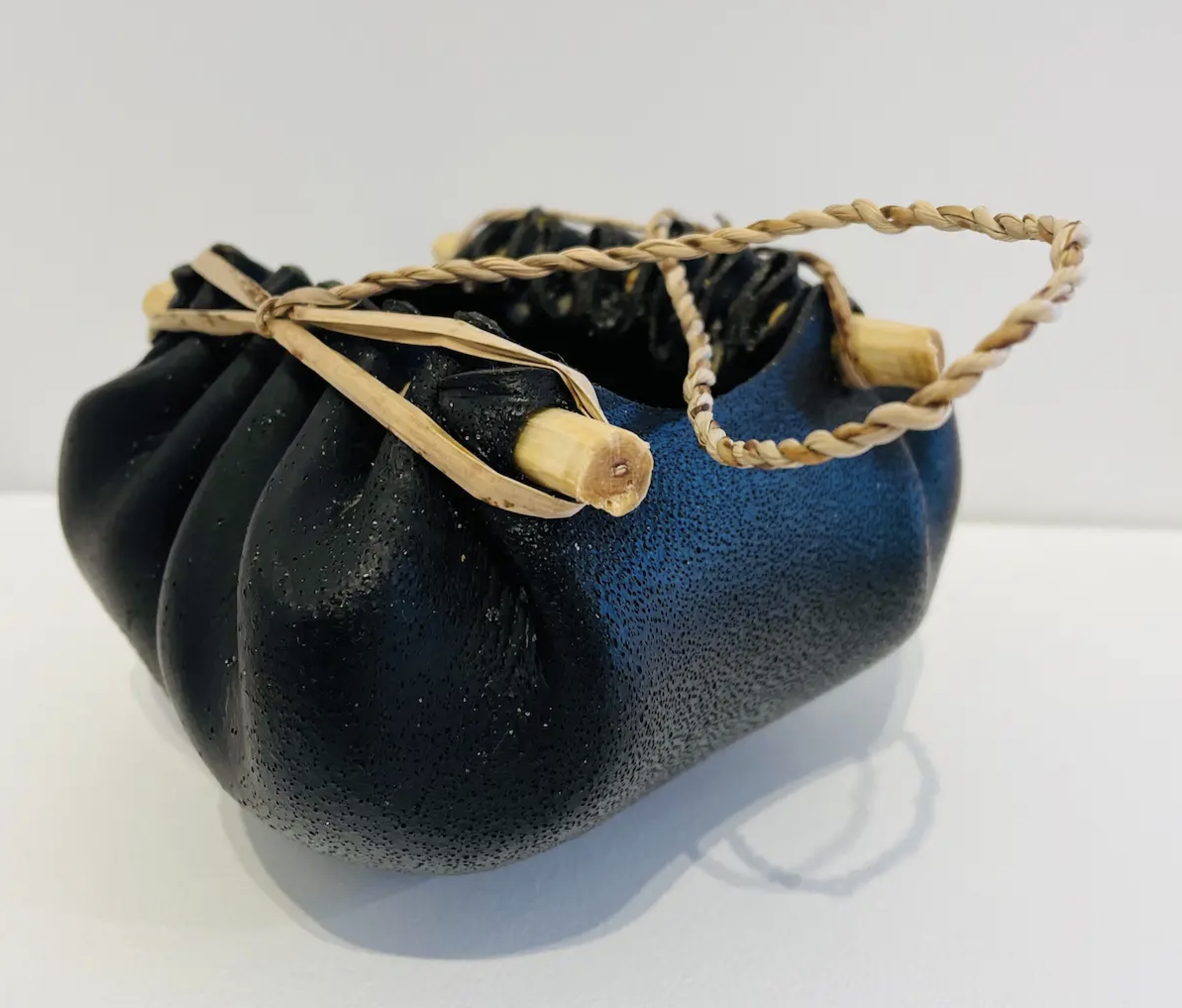 Nannette Shaw, Kelp vessel, 2021, bull kelp, native Tasmanian timber & river reed, (large), 8.5 x 13 x 12 cm (dimensions exclude handle)