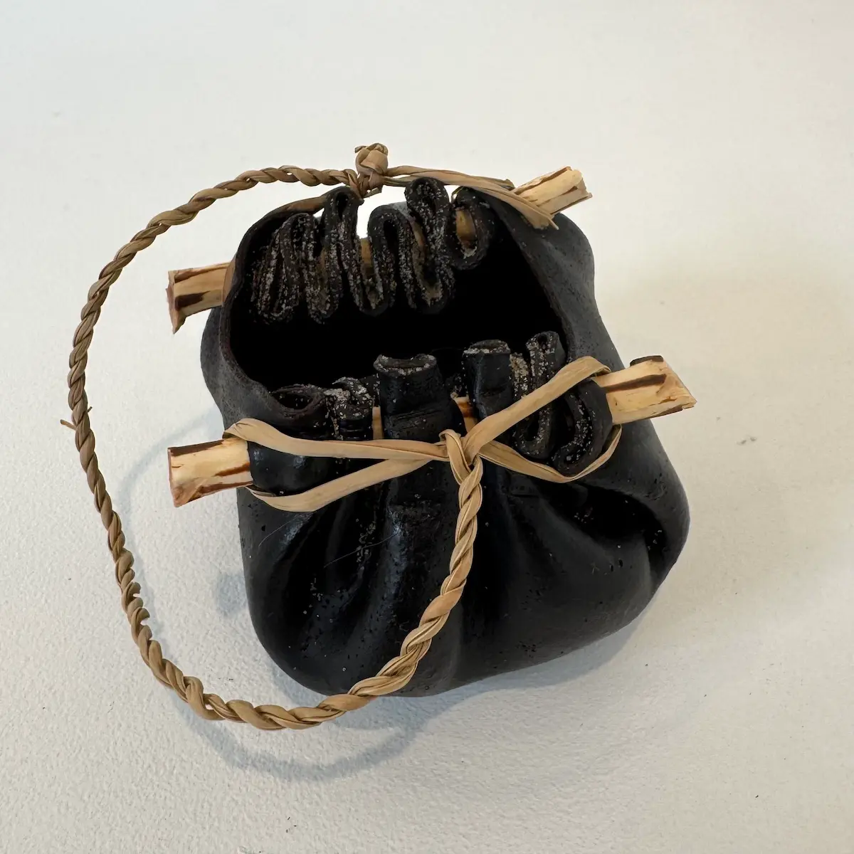 Kelp vessel, 2022, bull kelp, native Tasmanian timber & river reed, small, approximately 5 x 8 x 7 cm (dimensions exclude handle)