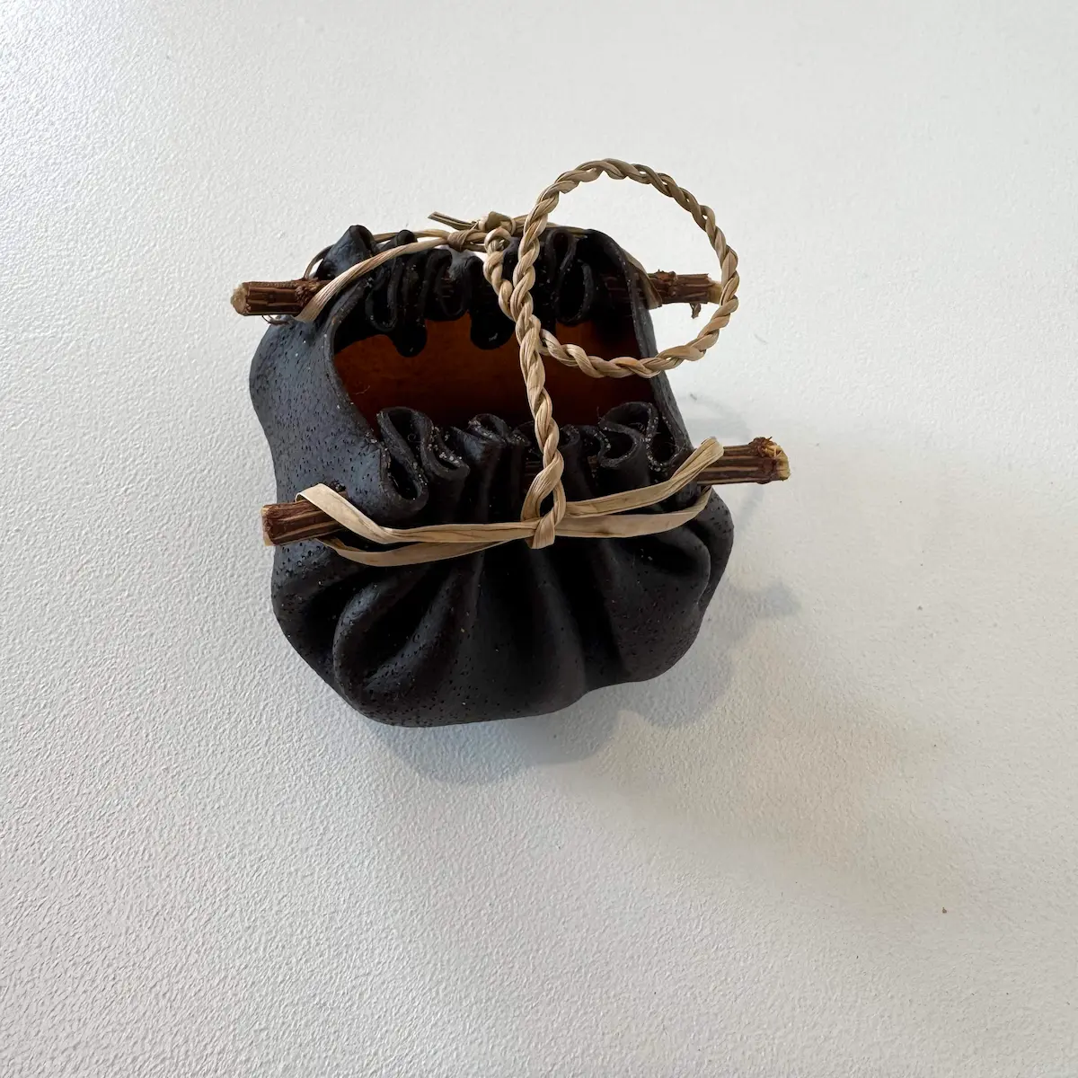 Kelp vessel, 2022, bull kelp, native Tasmanian timber & river reed, small, approximately 5 x 8 x 7 cm (dimensions exclude handle)